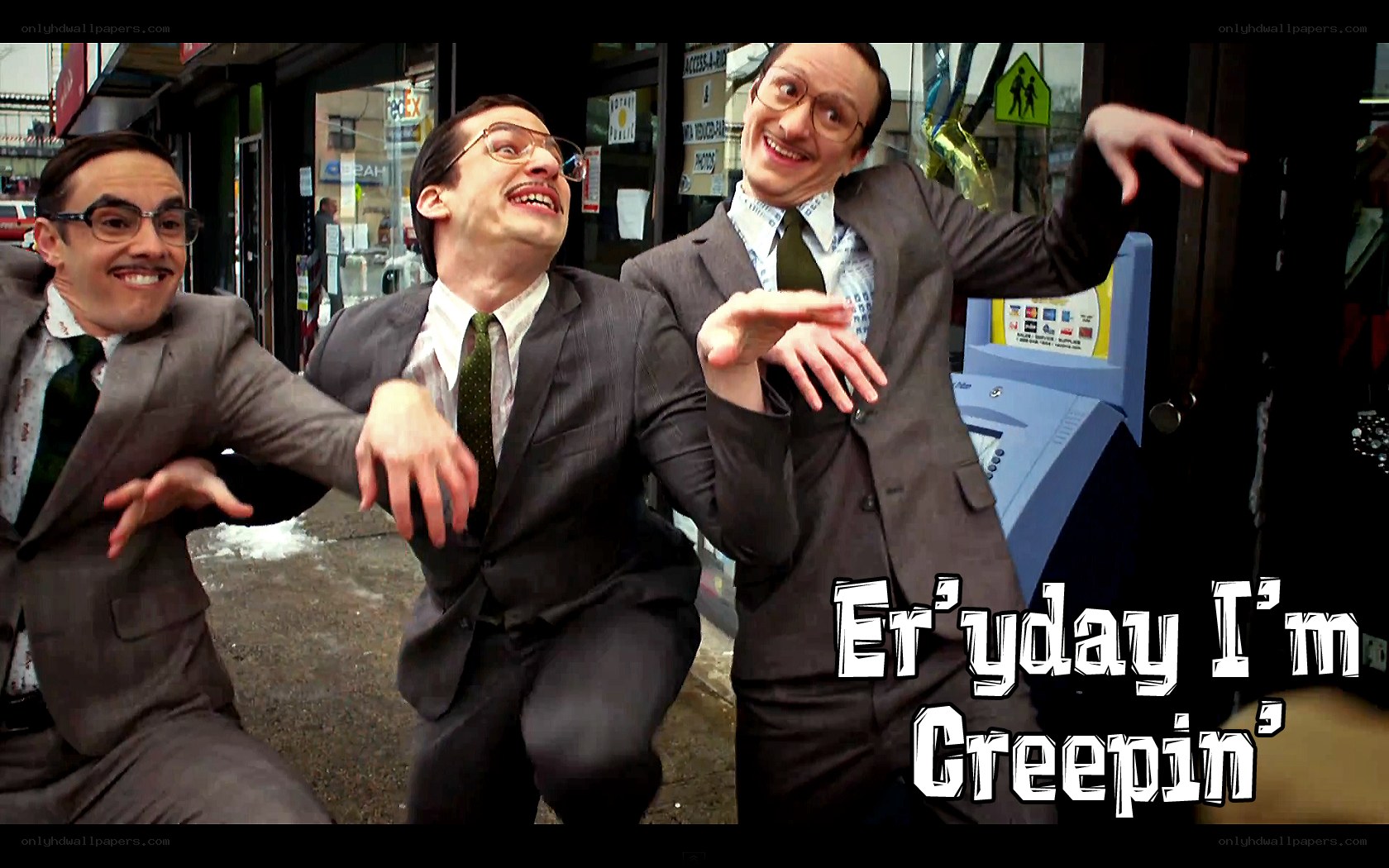 Three men in suits dancing