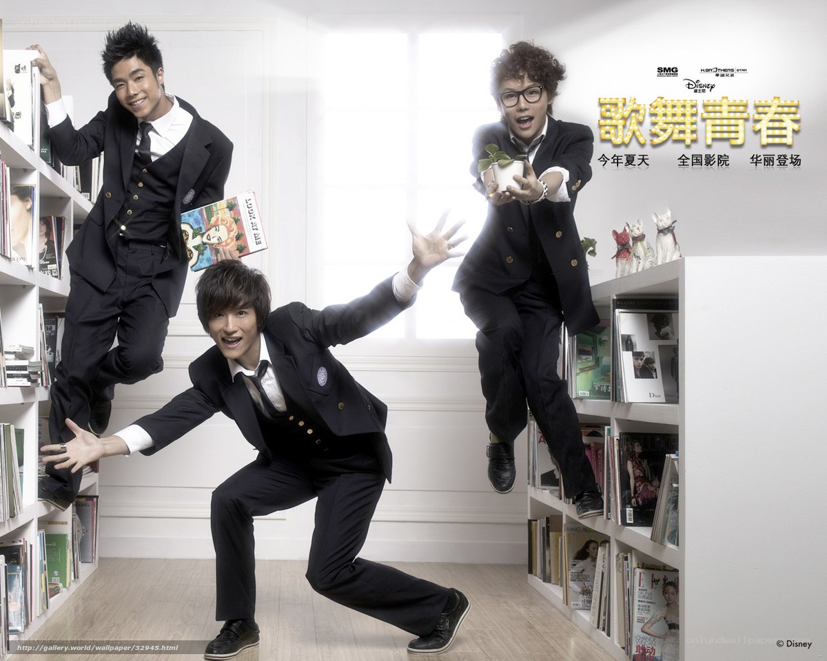 three men in suits in library