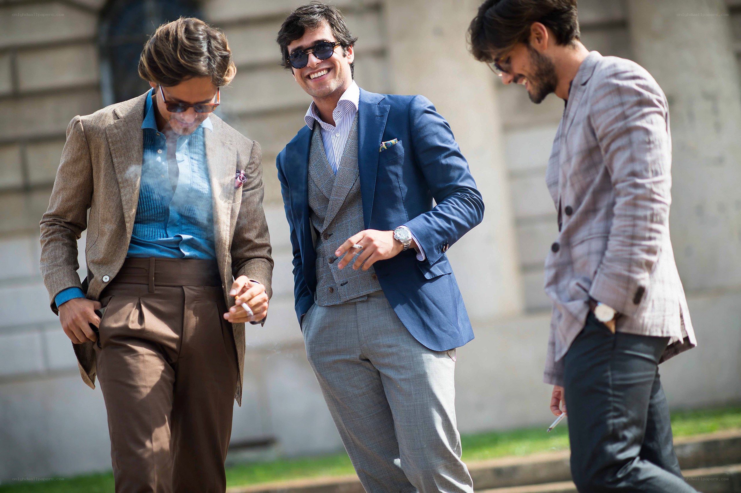 three men in suits walking