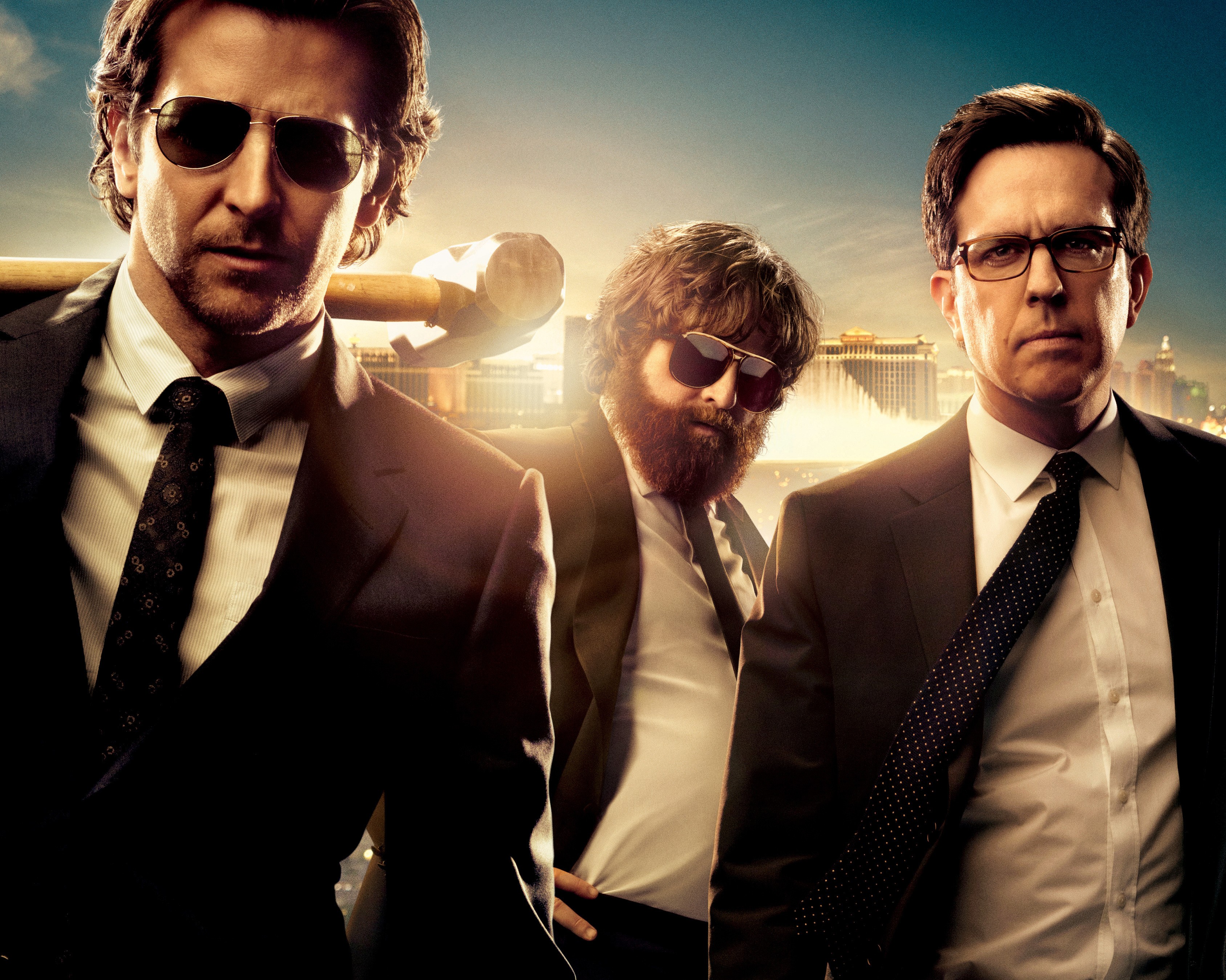 three men in suits with a hammer