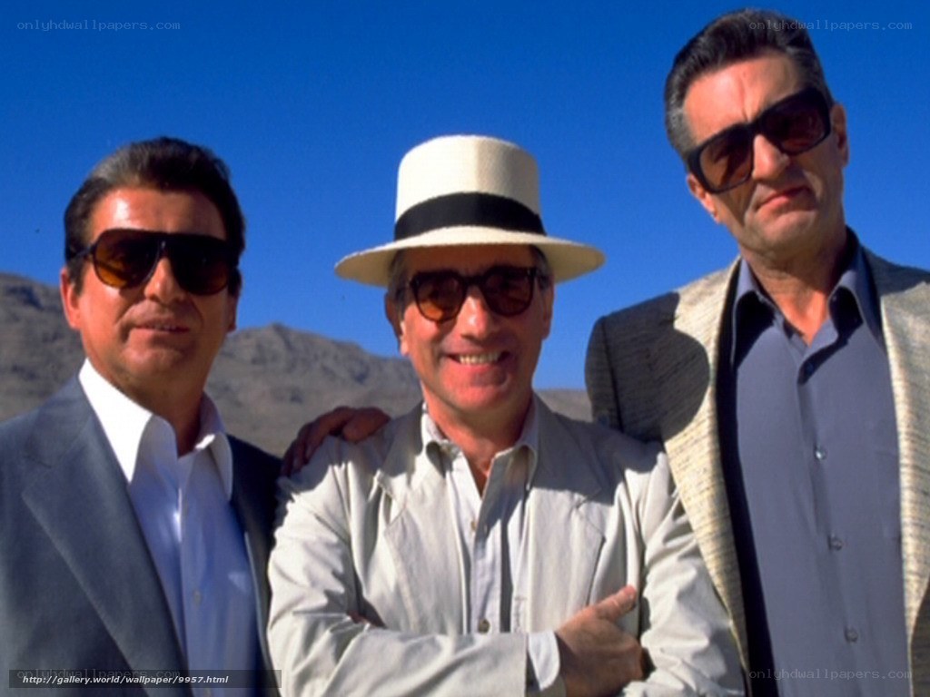 Three men in sunglasses and hats