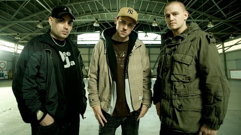 three men in warehouse