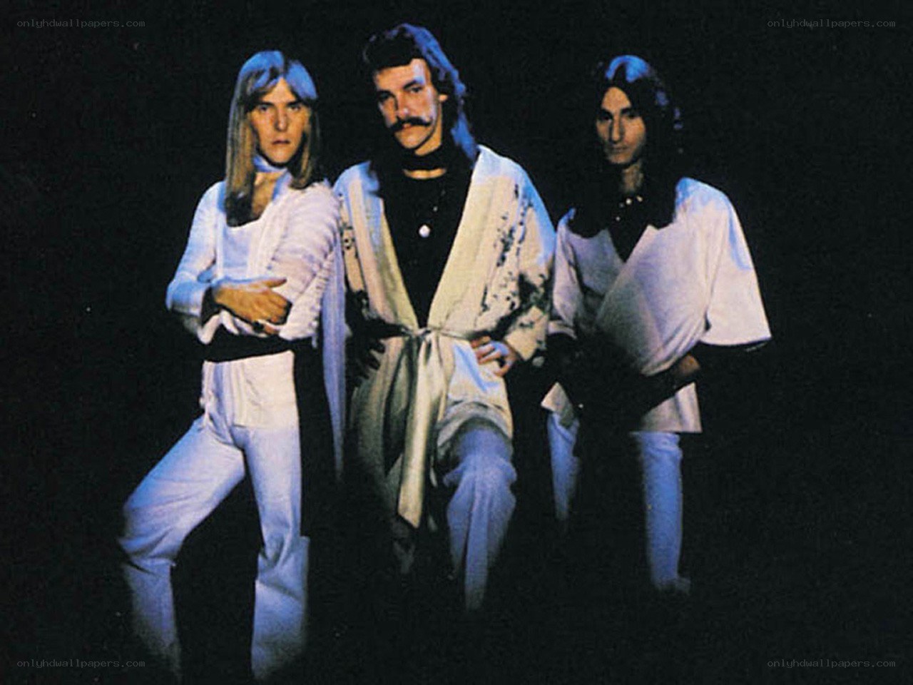 Three men in white outfits