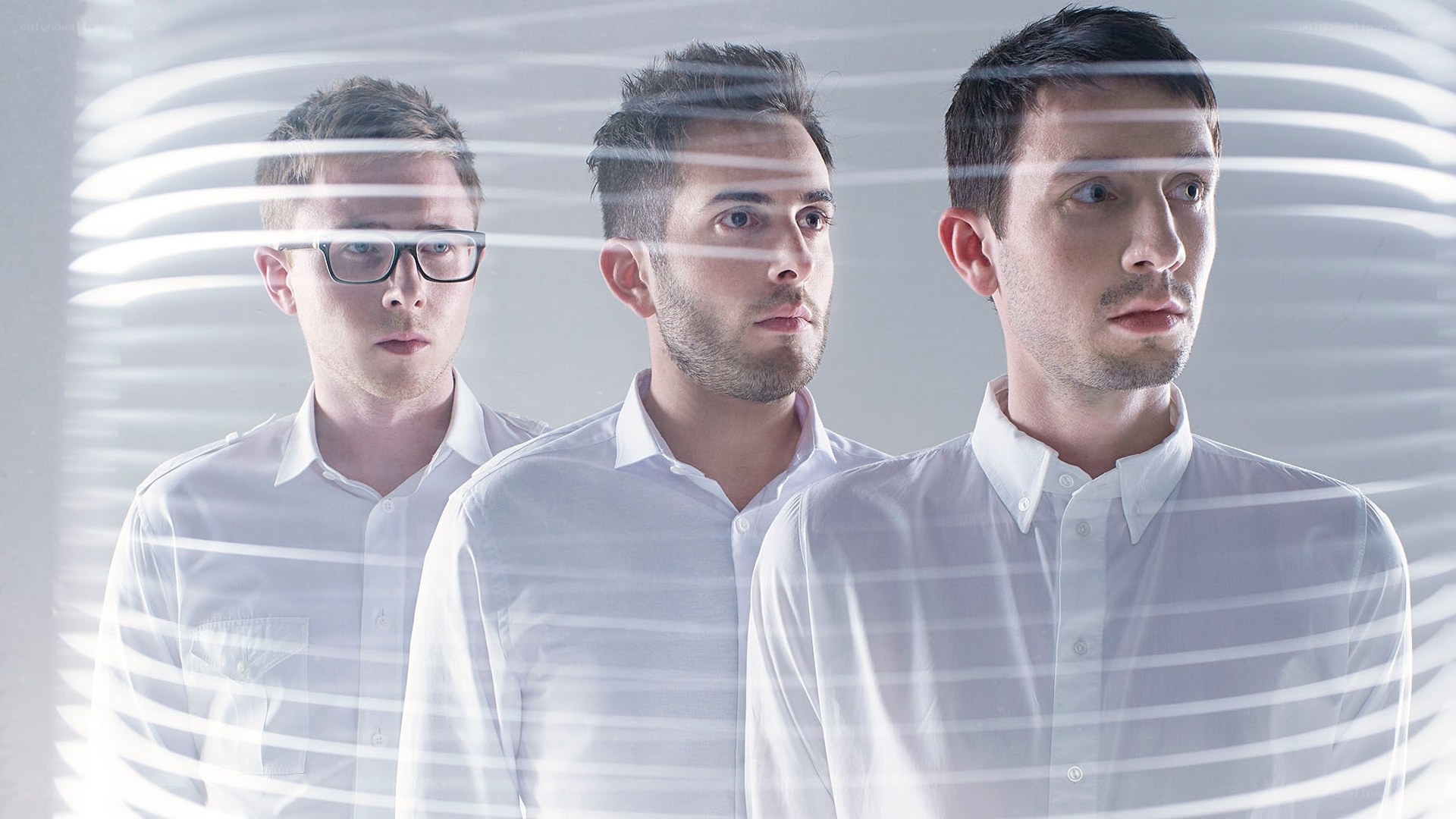 three men in white shirts