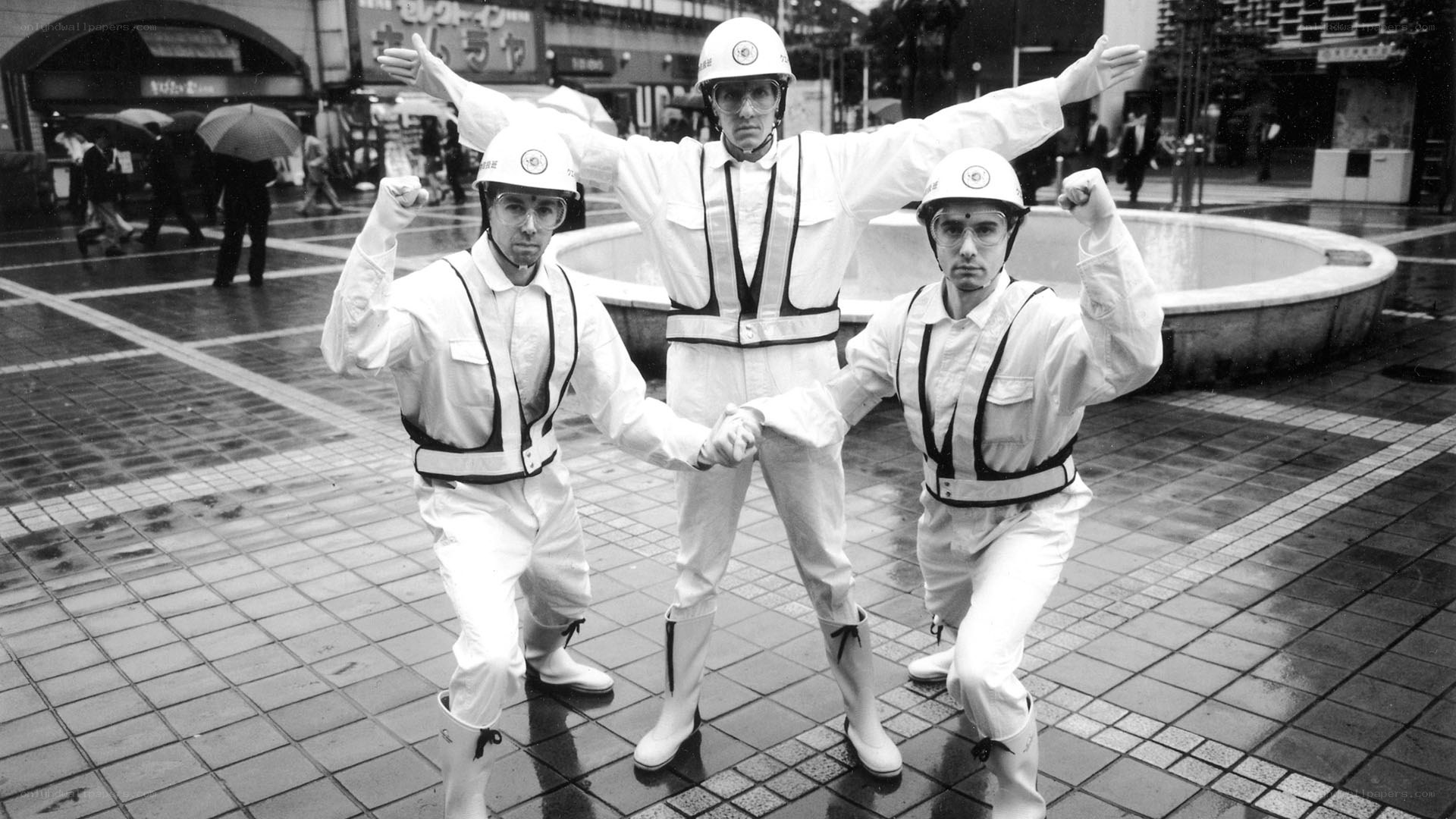 Three men in white uniforms
