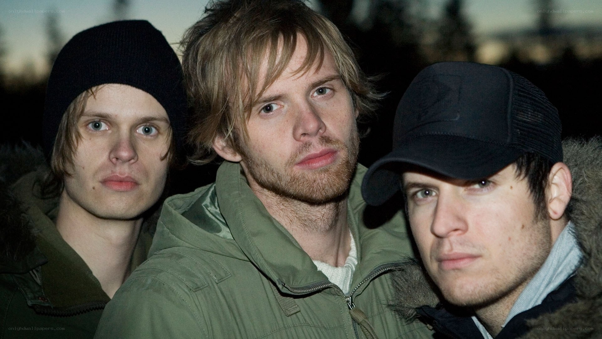 three men in winter clothing