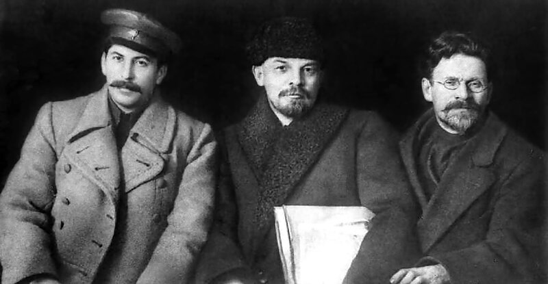 Three men in winter coats