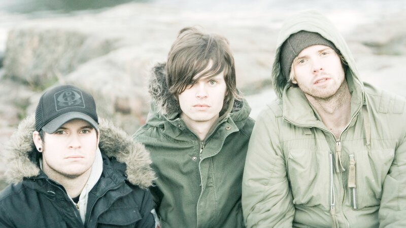 three men in winter jackets