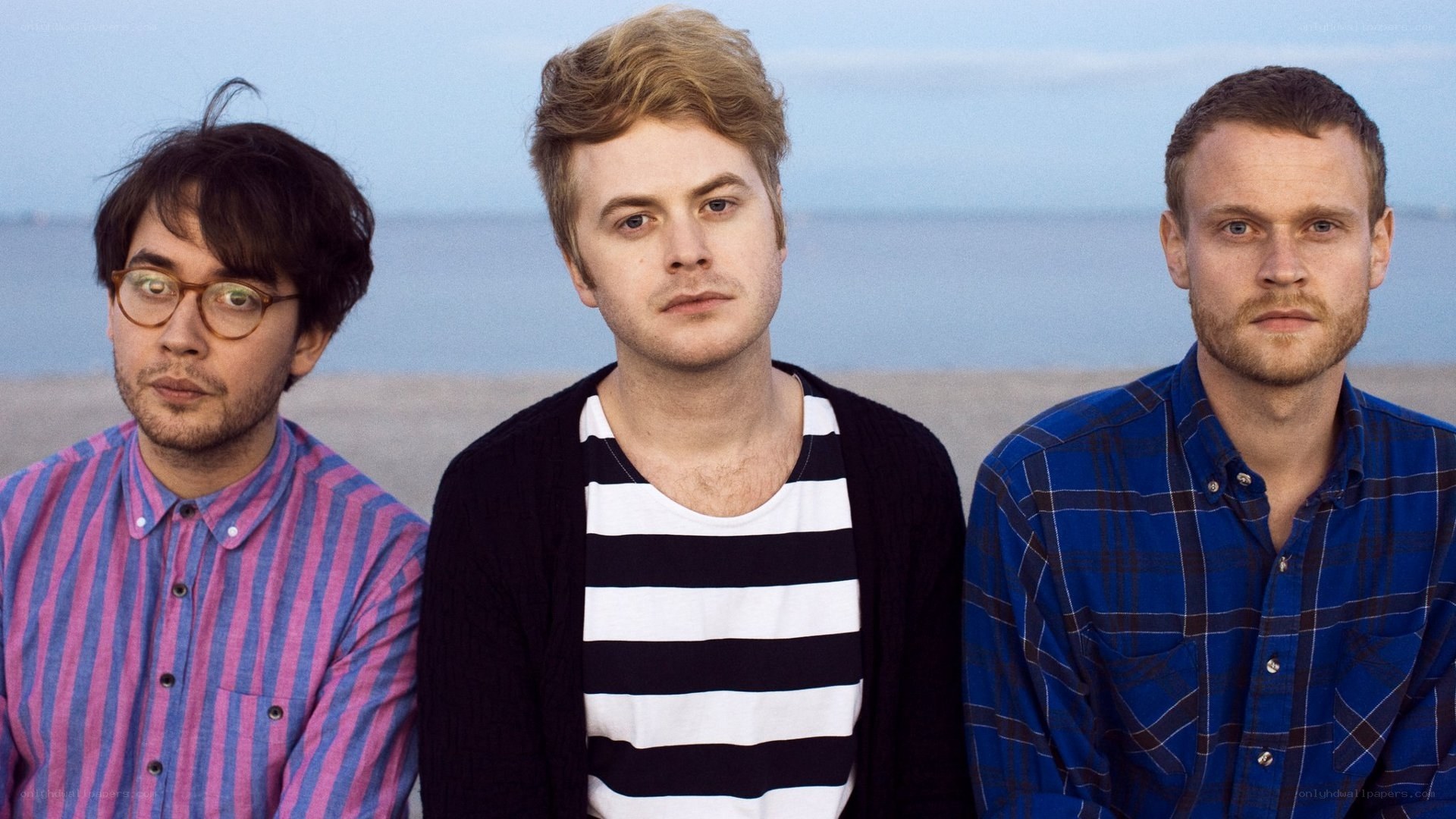three men on a beach