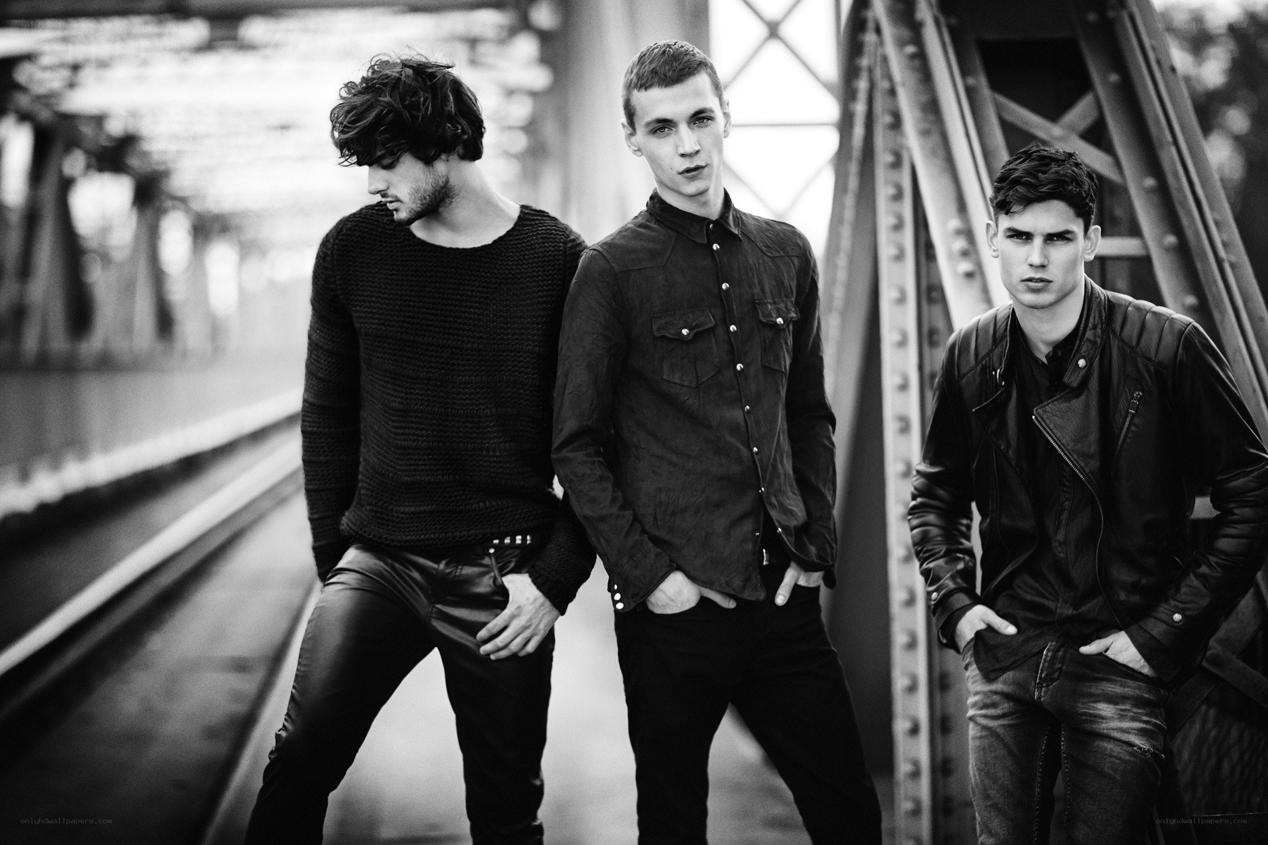 three men on a bridge