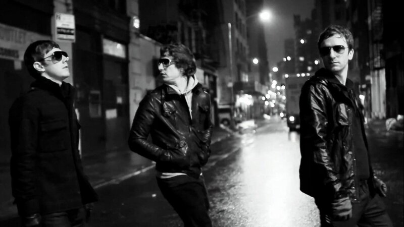 three men on a city street