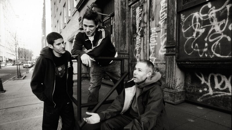 three men on a city street
