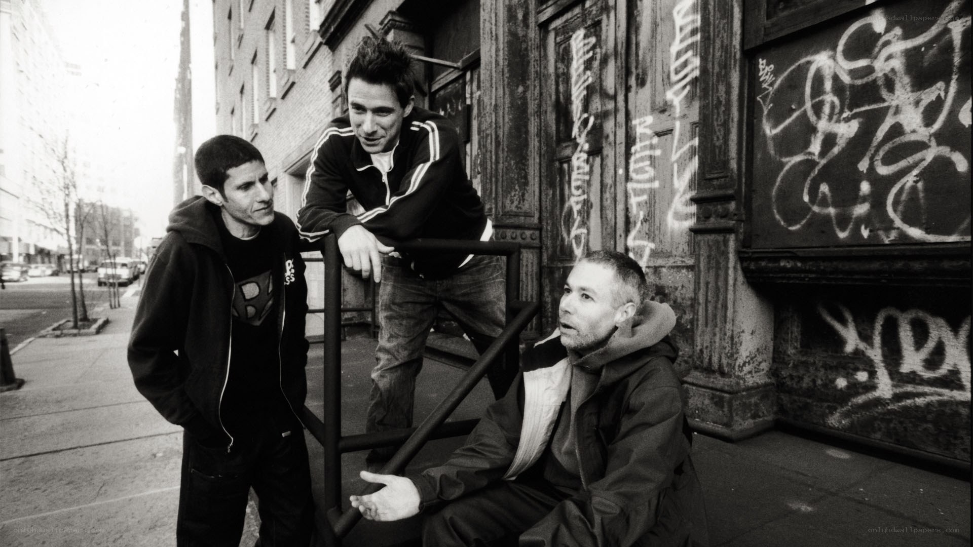 three men on a city street