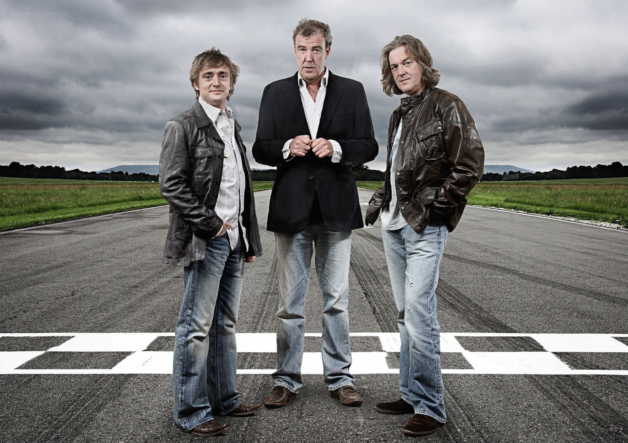 Three men on a racetrack