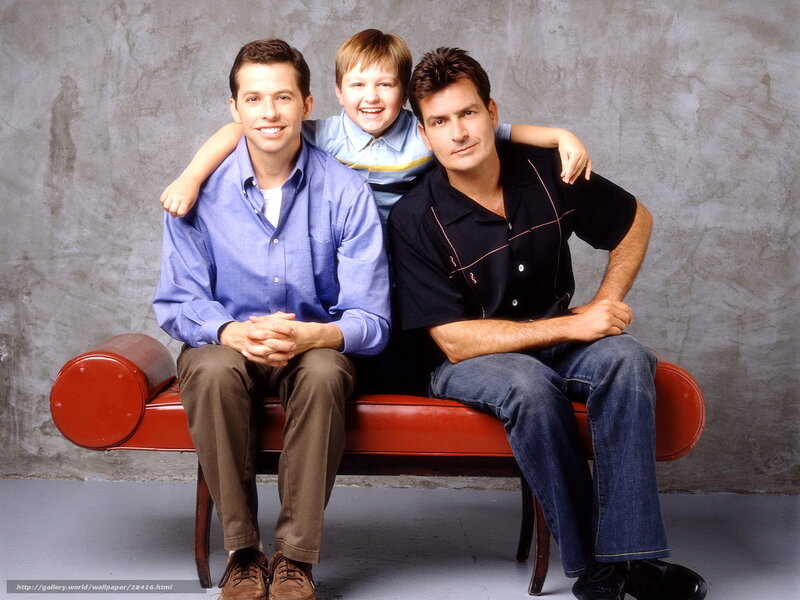 Three men on a red bench