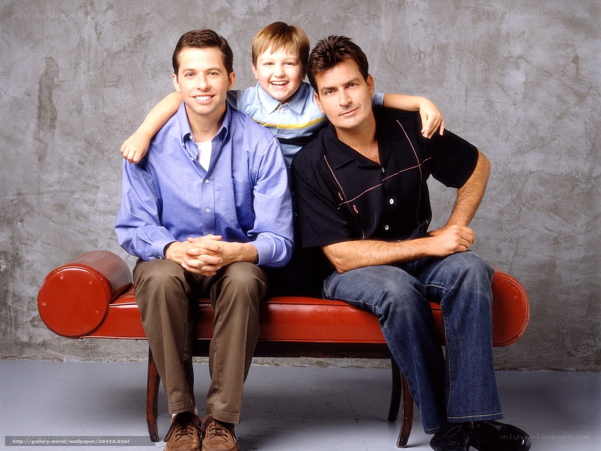 Three men on a red bench