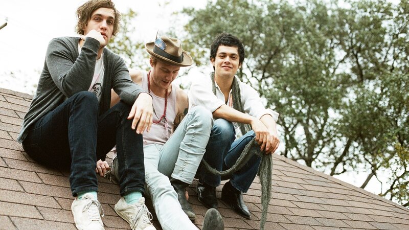 three men on a roof