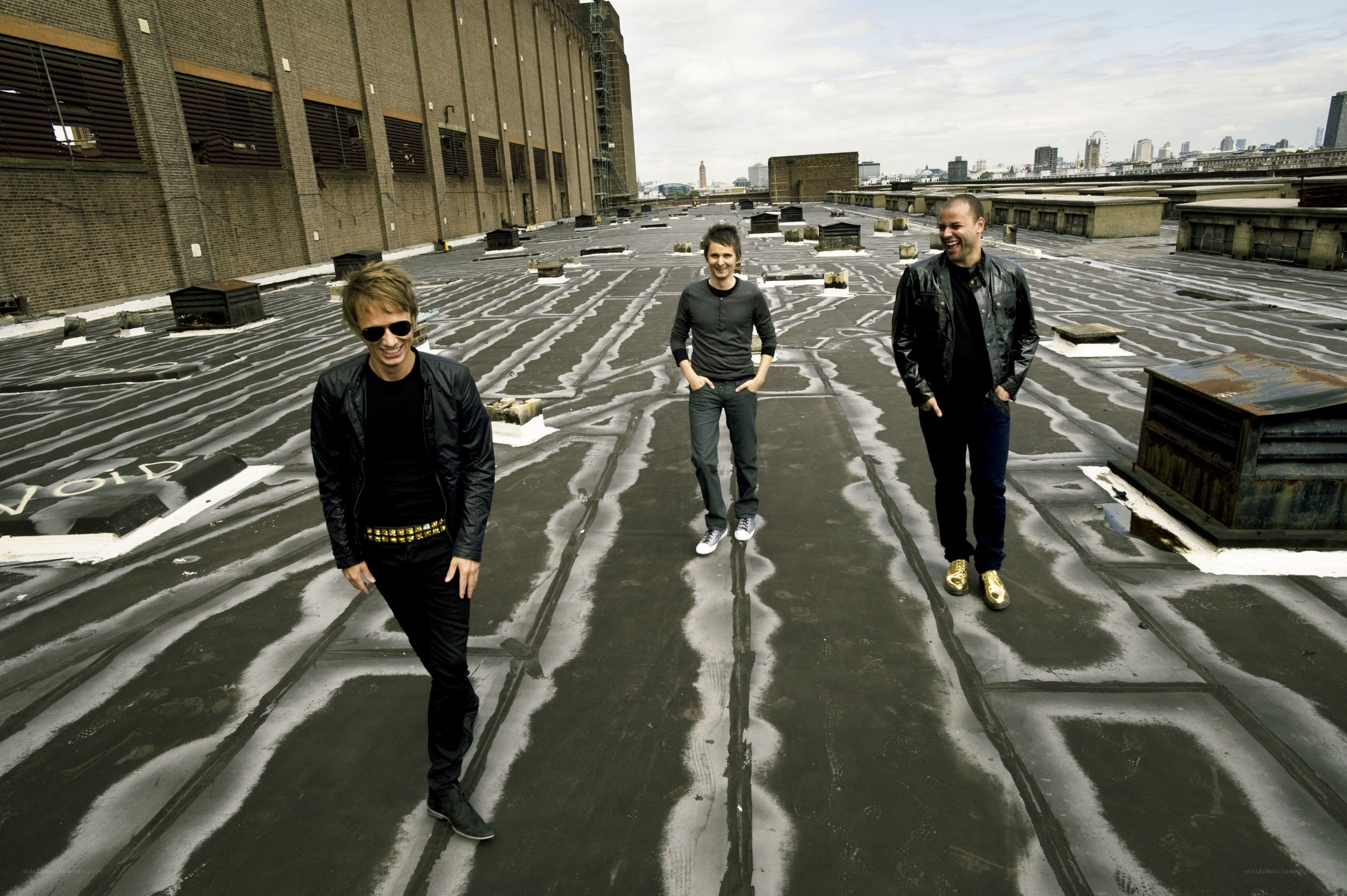 three men on a rooftop