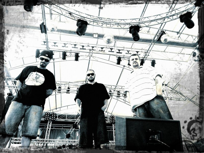 three men on a stage
