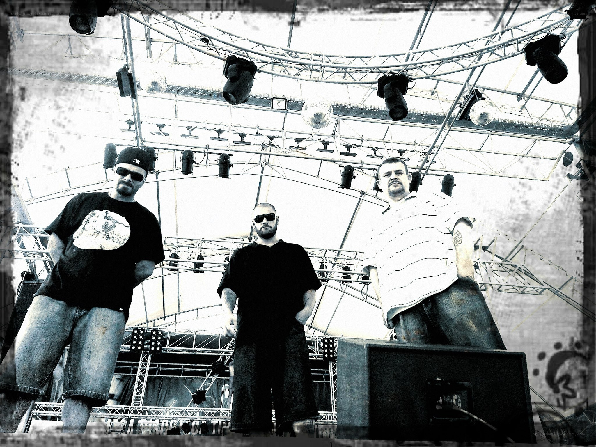 three men on a stage
