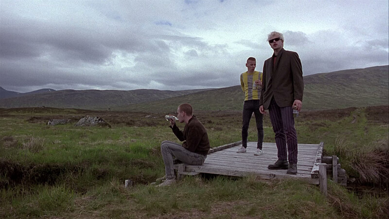 Three men on a wooden platform