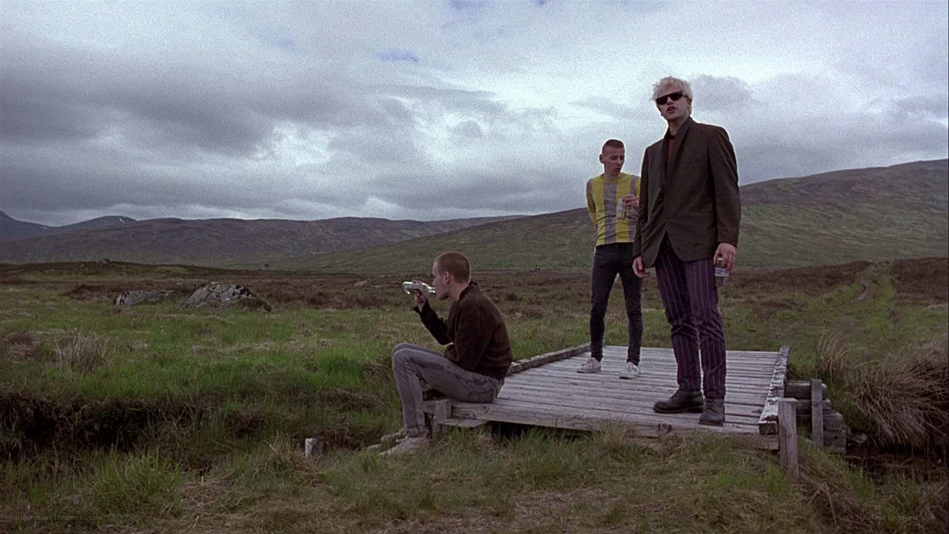 Three men on a wooden platform