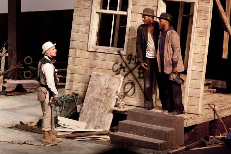 Three Men on Stage — Brown