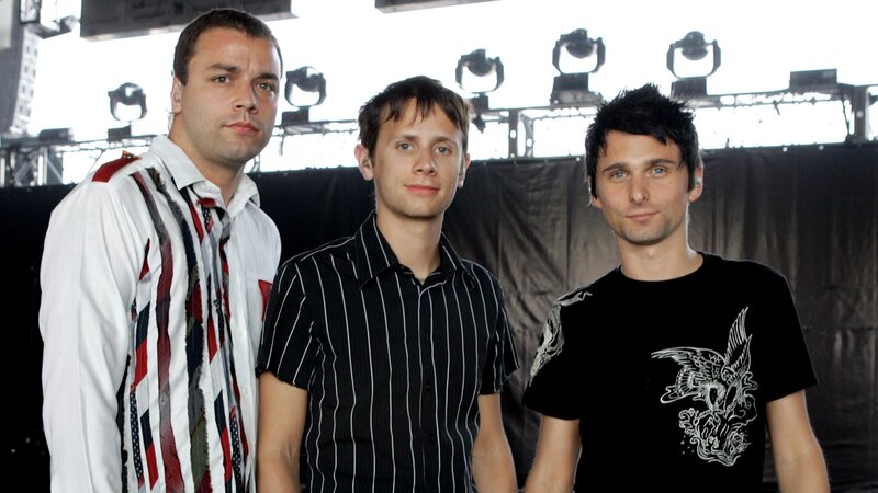 three men on stage