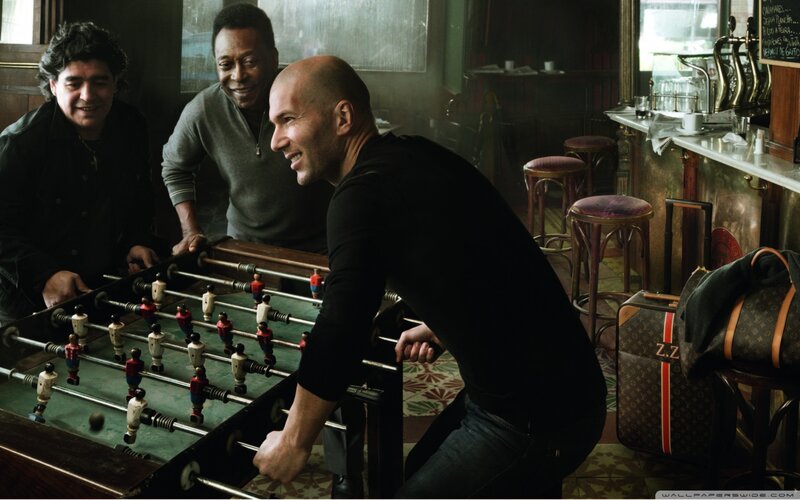 Three Men Playing Foosball — Black