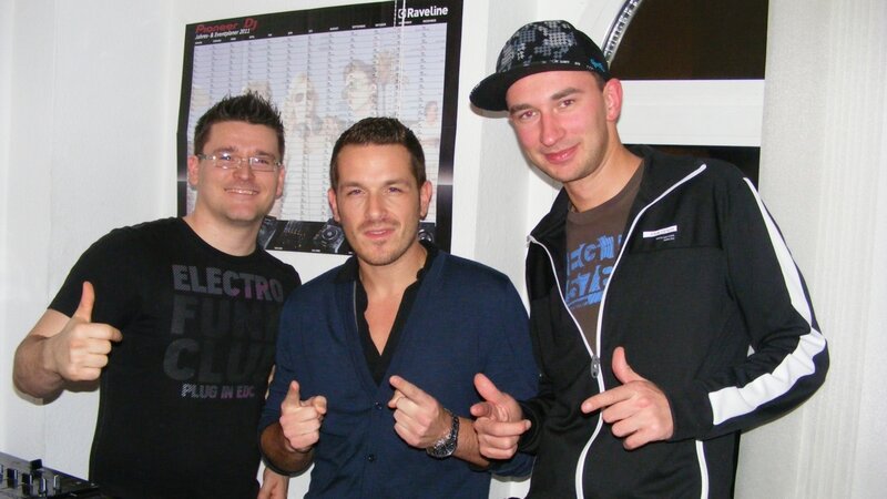 Three men posing at a DJ event