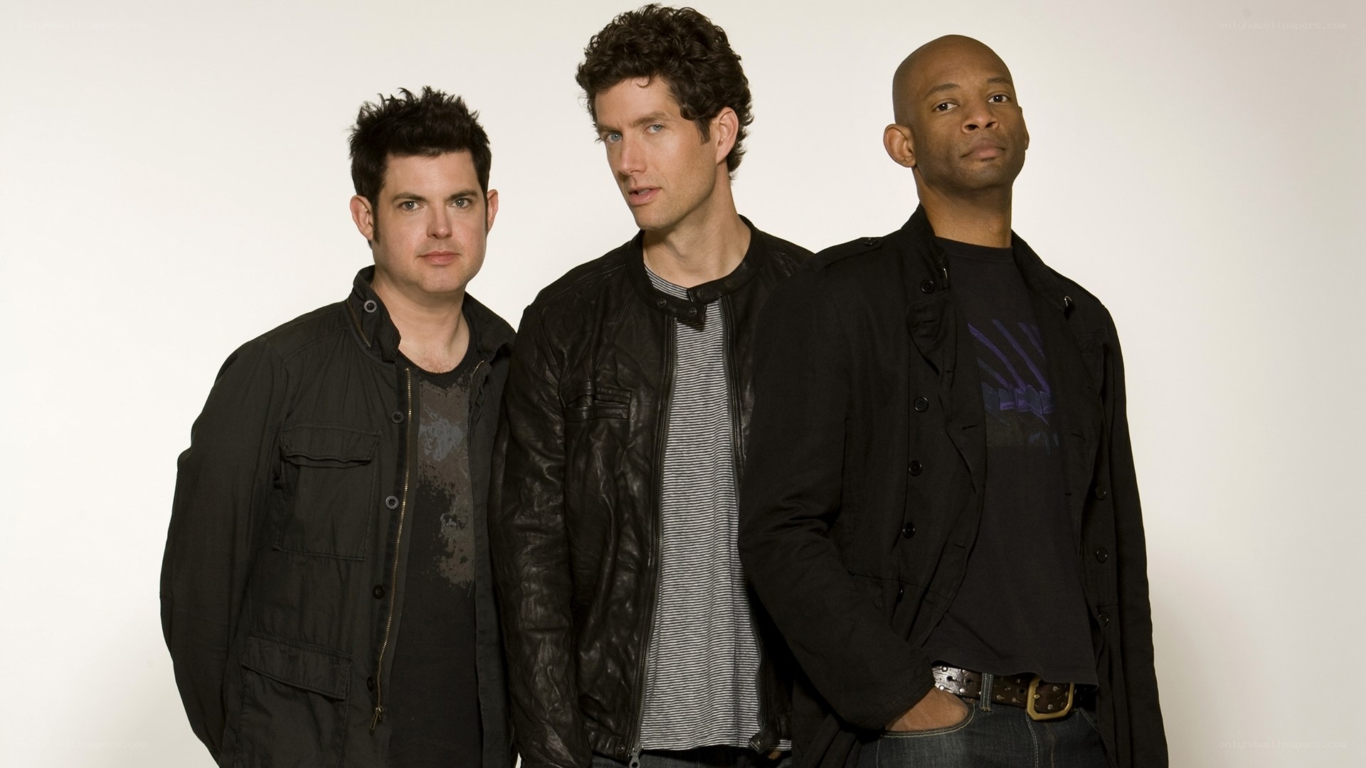 three men posing for a photo