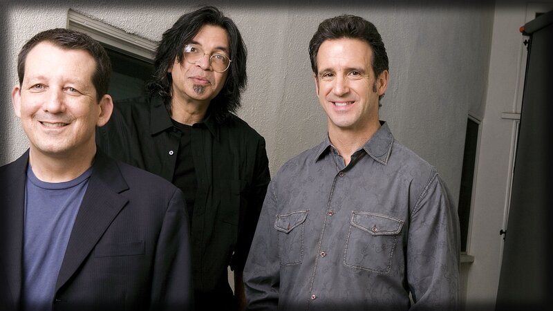 three men posing for a photo