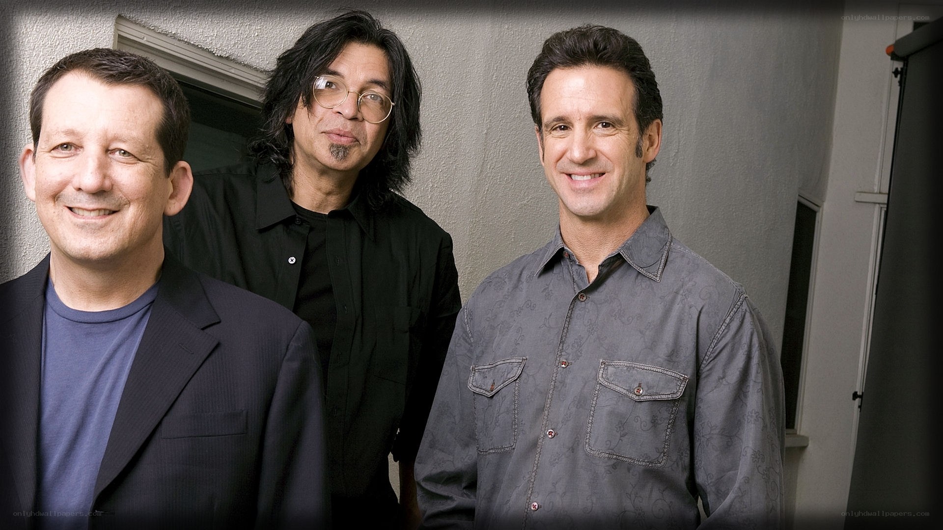 three men posing for a photo
