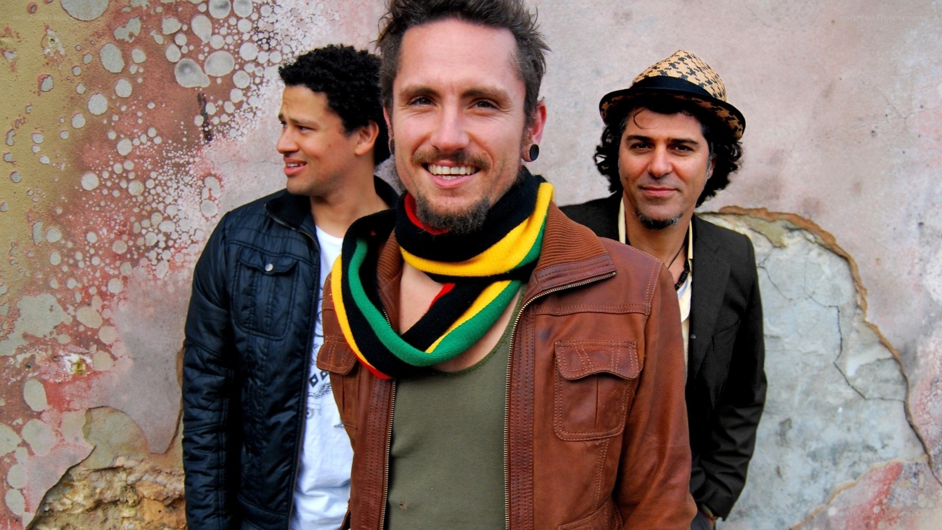 three men posing together