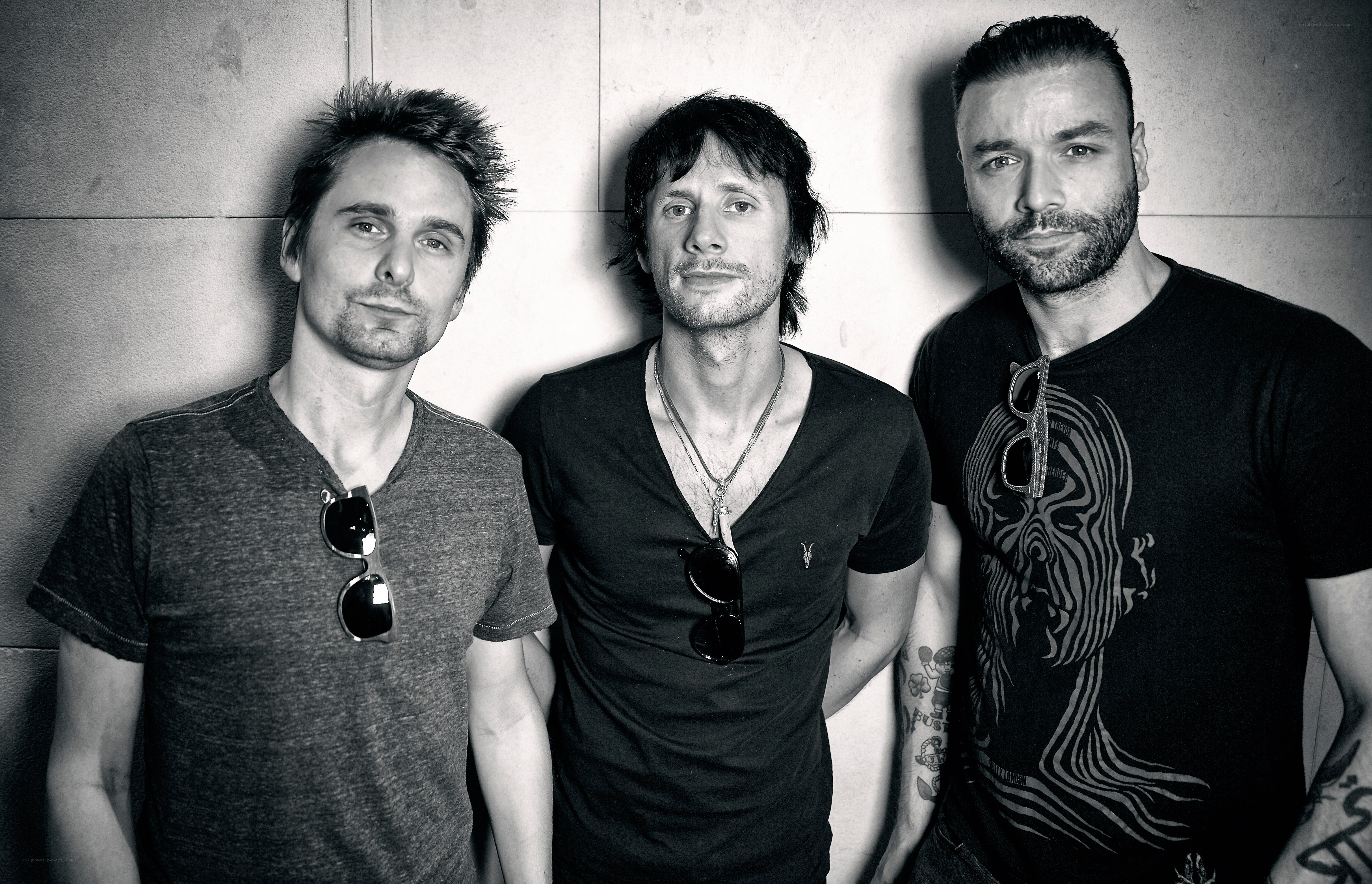 three men posing together