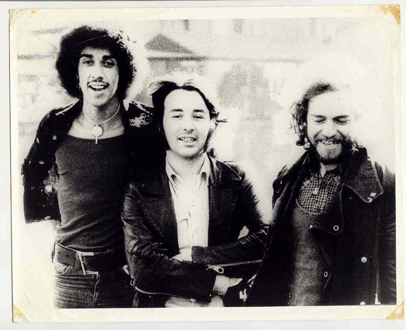Three men posing together