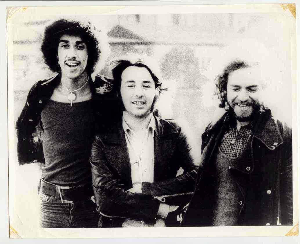 Three men posing together