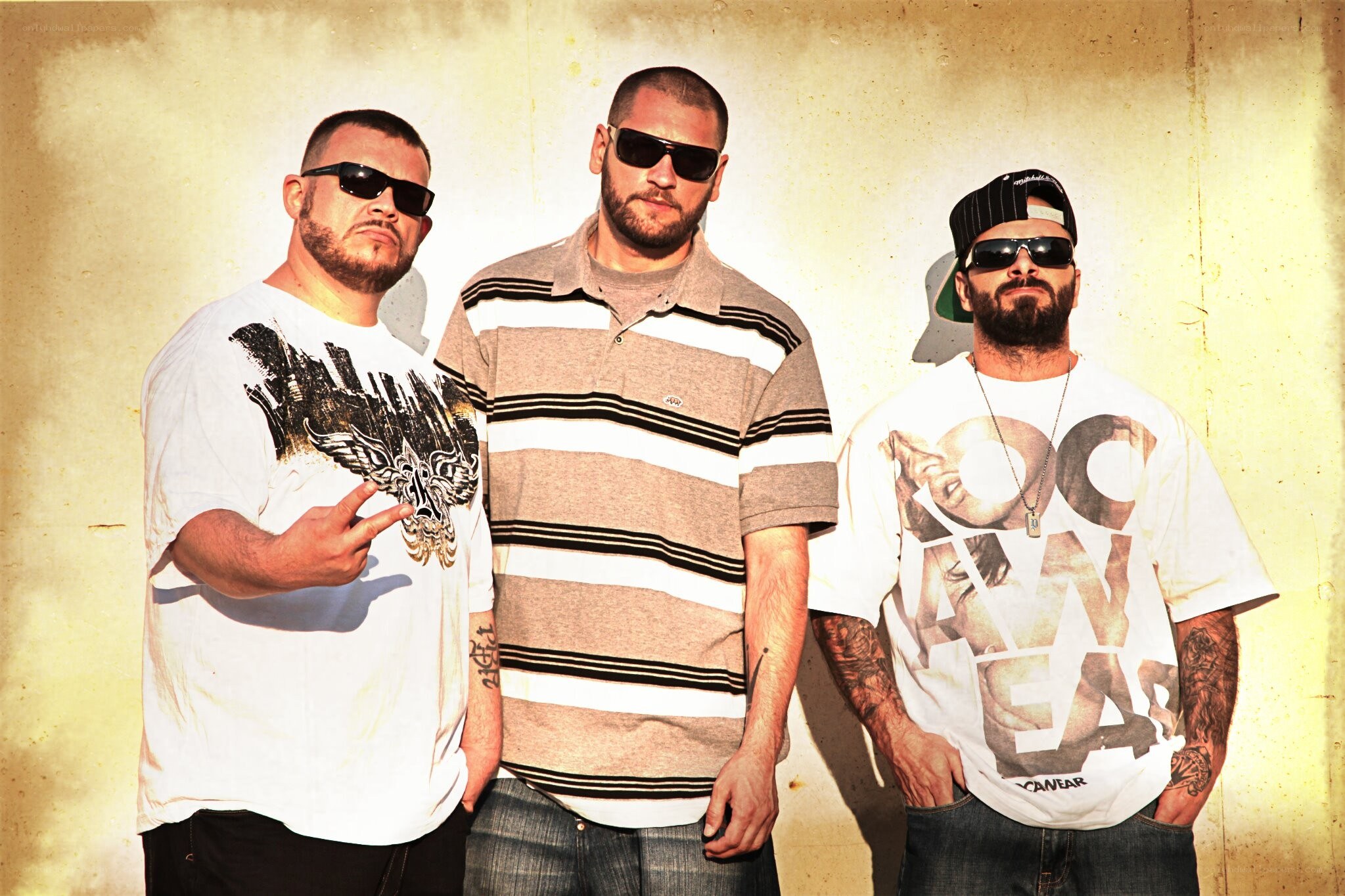 three men posing together