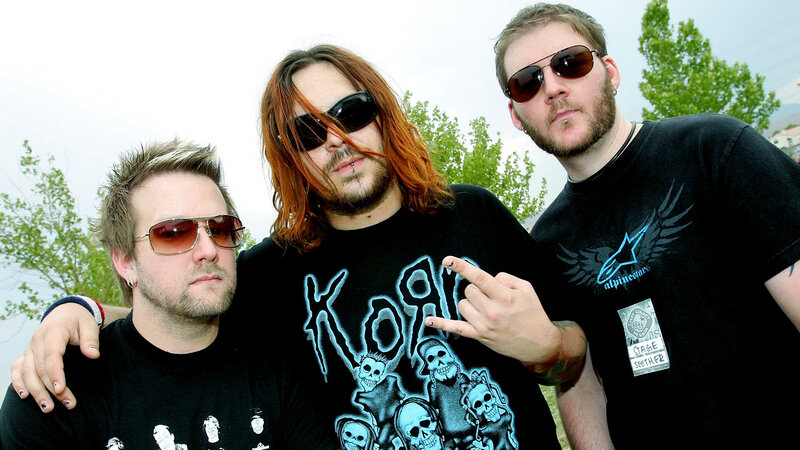 Three Men Posing Together — Black, Casual, Afternoon
