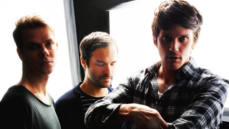 Three Men Standing — Black, Serious, Photograph