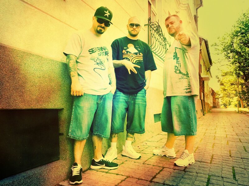Three Men Standing — Yellow, Confident