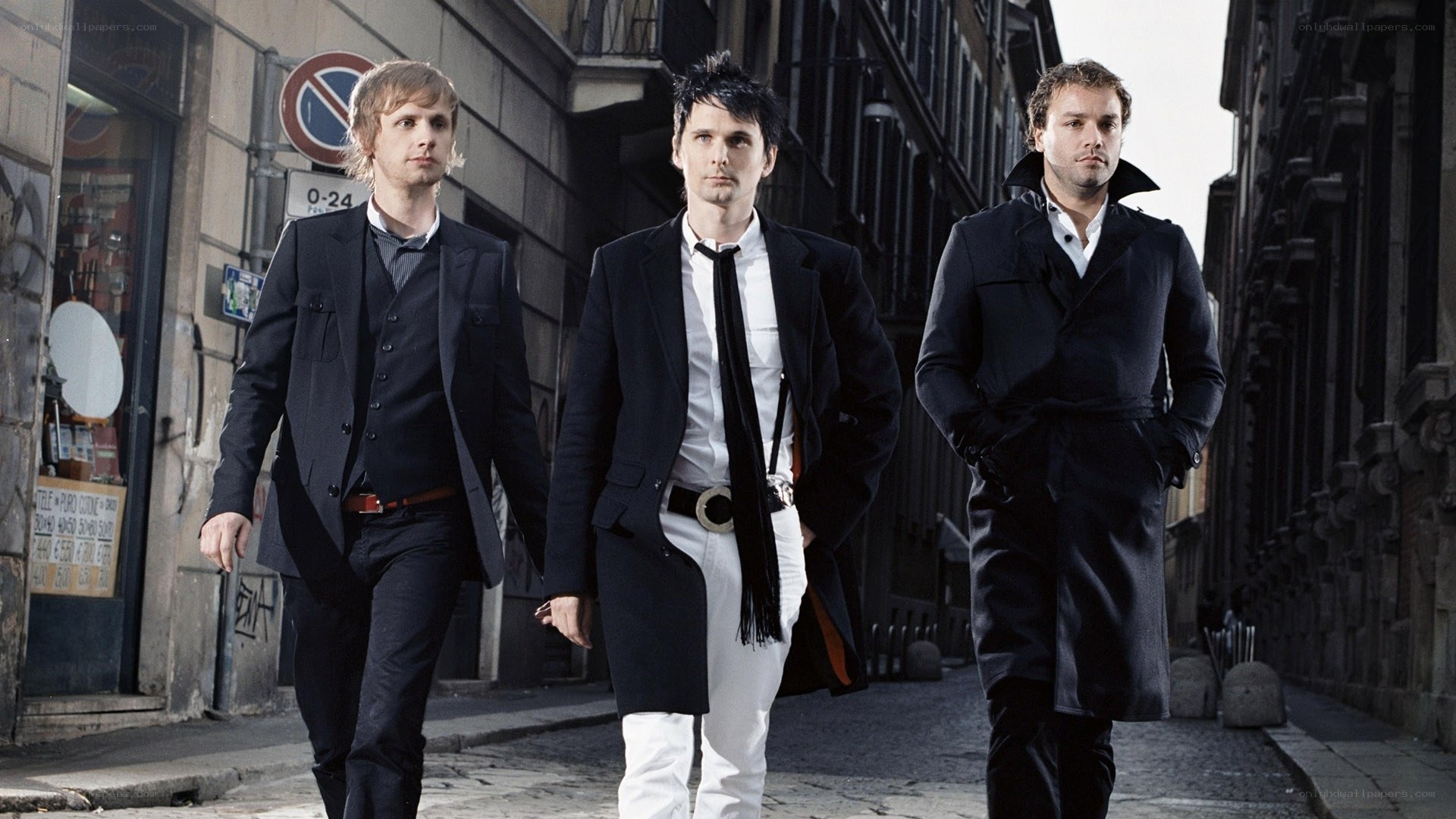 three men walking in city