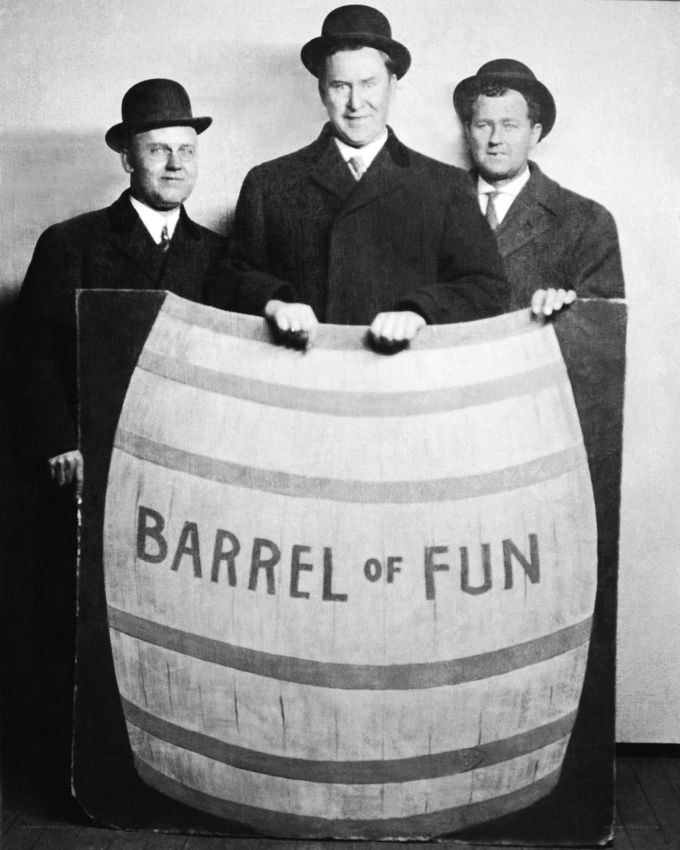 Three men with barrel sign