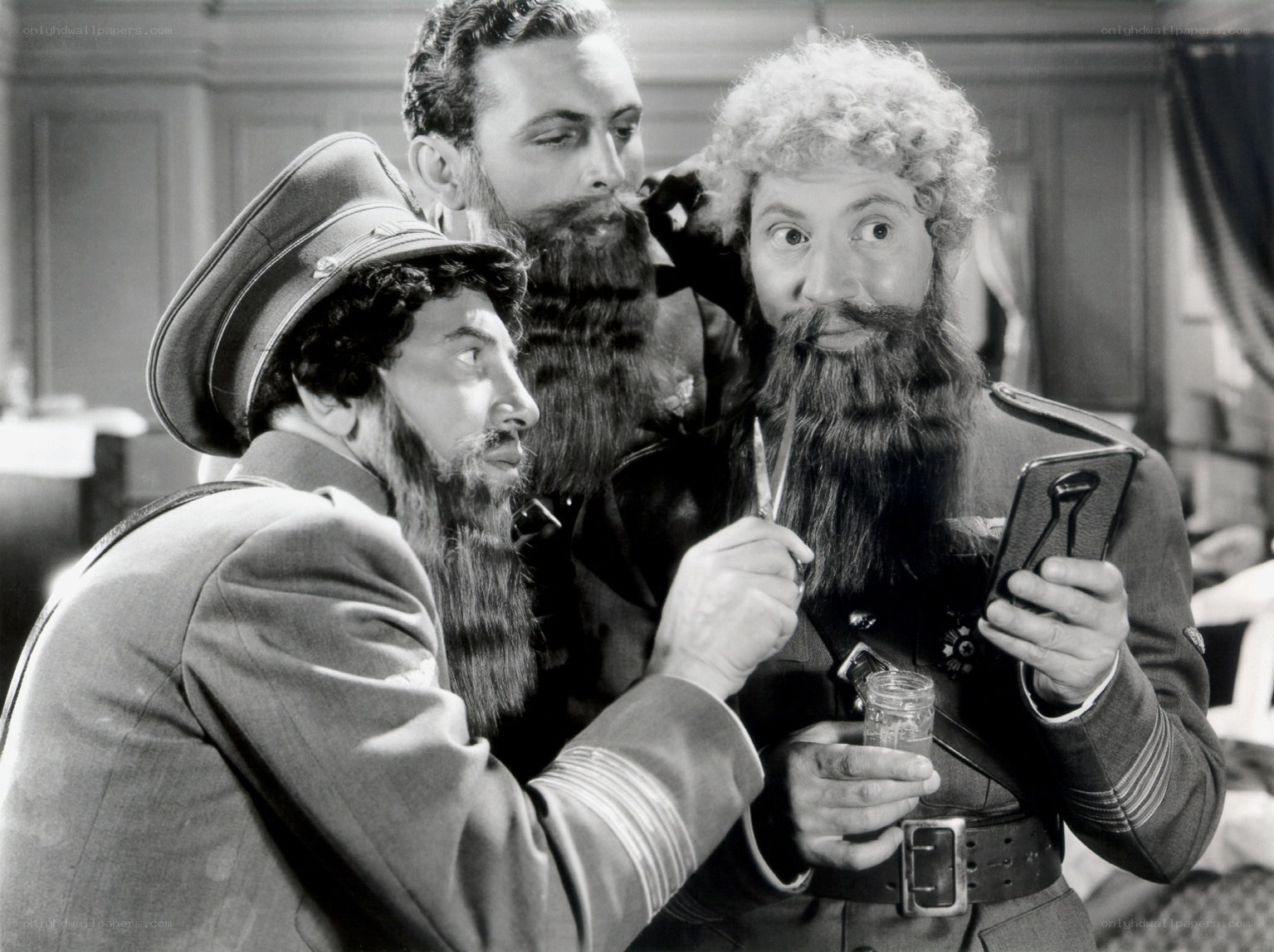 Three men with beards in military uniforms