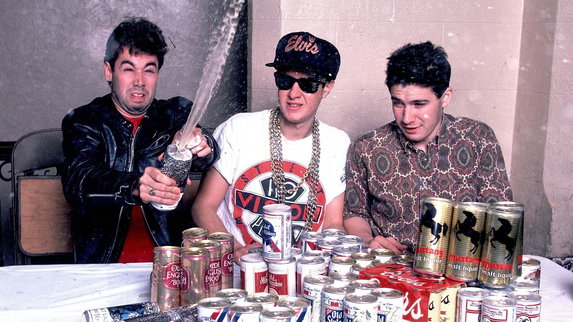 Three men with beer cans