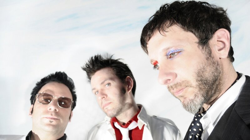 three men with colorful makeup
