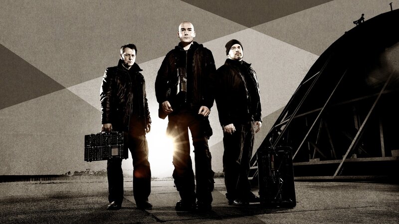 three men with equipment