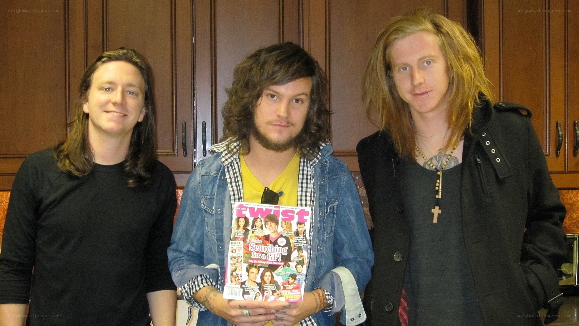 Three men with magazine