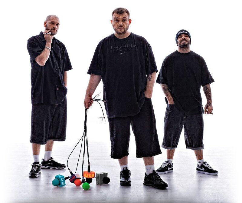 three men with microphones
