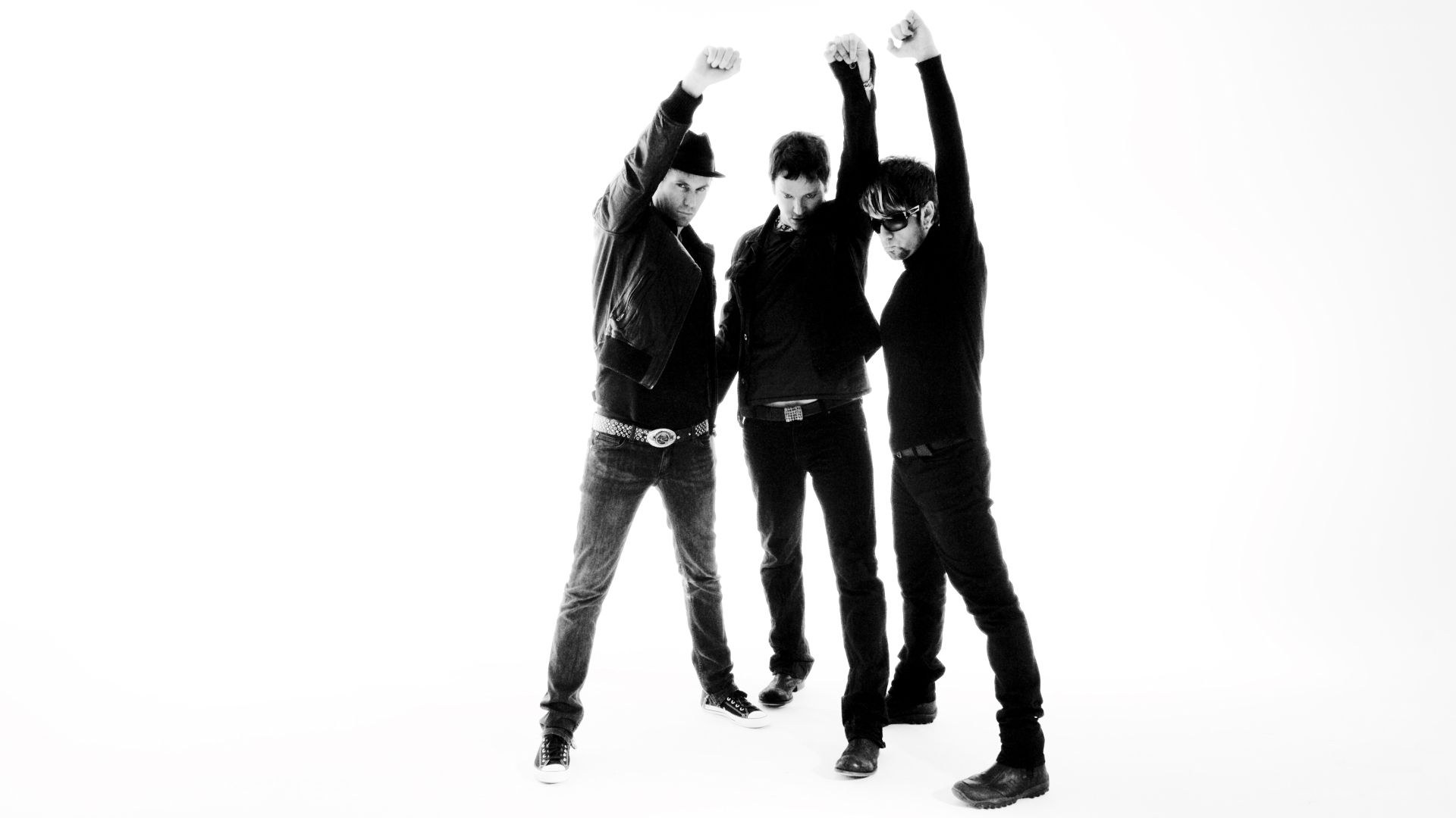 three men with raised fists